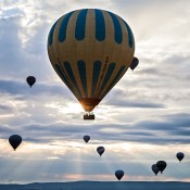 Experience the magic of a hot air balloon ride in Cappadocia, floating over fairy chimneys and valleys at sunrise, a must-do adventure for travelers