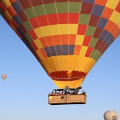 Experience a breathtaking balloon ride over Cappadocia's fairy chimneys and valleys at sunrise, book now for an unforgettable adventure in Turkey